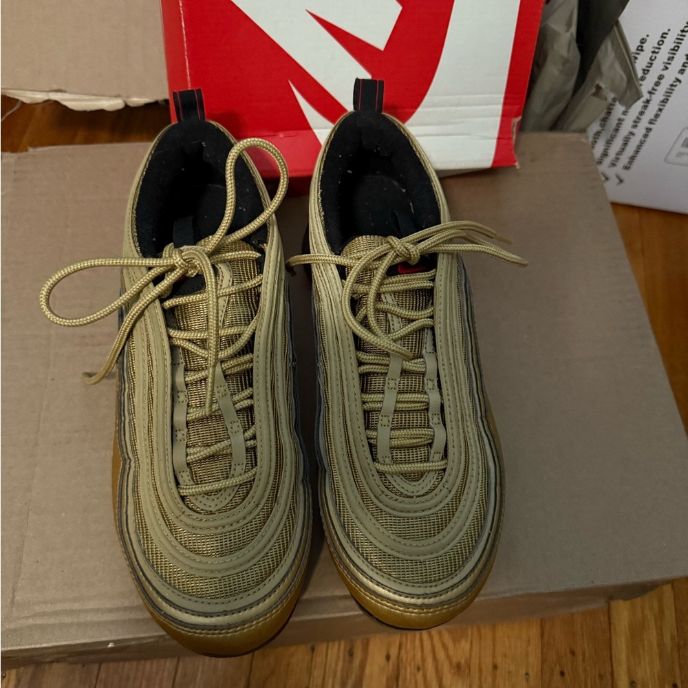 Nike Air Max 97 Sneakers. Stylish metallic gold/ varsity red-black-white
